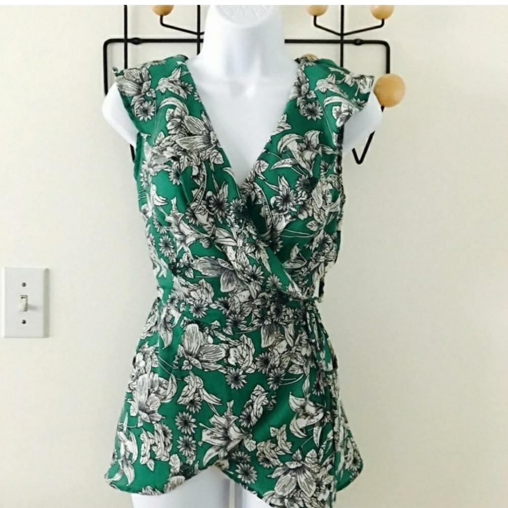 Green and white wrap top with ruffle details
